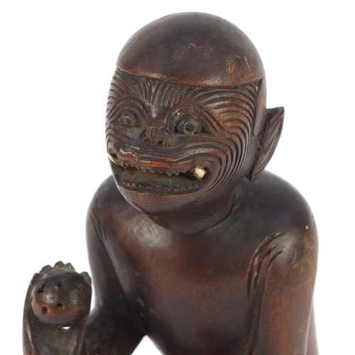 606a - Tribal interest carved wood figure, possibly Polynesian, 22.5cm high