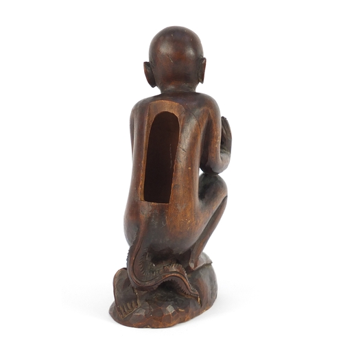 606a - Tribal interest carved wood figure, possibly Polynesian, 22.5cm high