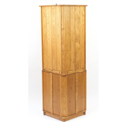 52 - Ercol light elm corner cupboard with three open shelves above cupboard base, 179cm H x 76cm W x 50cm... 