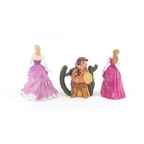 2165 - Royal Doulton Cowboy and Indian teapot and two figurines, Highland Belle HN4743 and Victoria HN4623