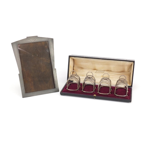 2292 - Set of four miniature silver plated toast racks, housed in a Harrods box and an Art Deco pewter ease... 