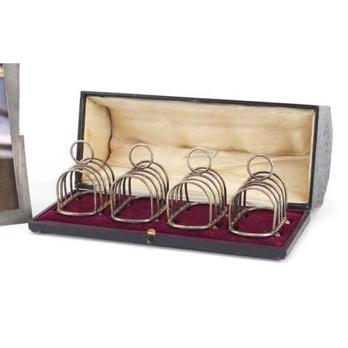 2292 - Set of four miniature silver plated toast racks, housed in a Harrods box and an Art Deco pewter ease... 