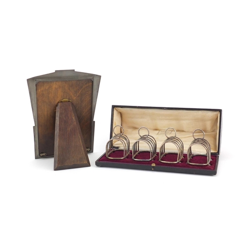 2292 - Set of four miniature silver plated toast racks, housed in a Harrods box and an Art Deco pewter ease... 