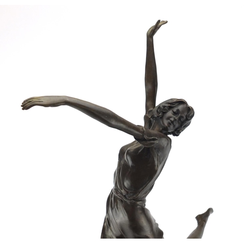 2073 - Large patinated bronze figure of an Art Deco female after B Zach, raised on a tapering black and red... 