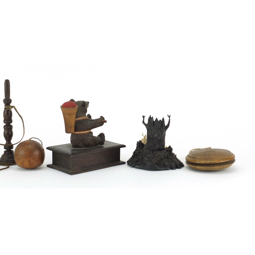 2301 - Antique objects including two treen bilboquet games and a carved black forest bear design pin cushio... 