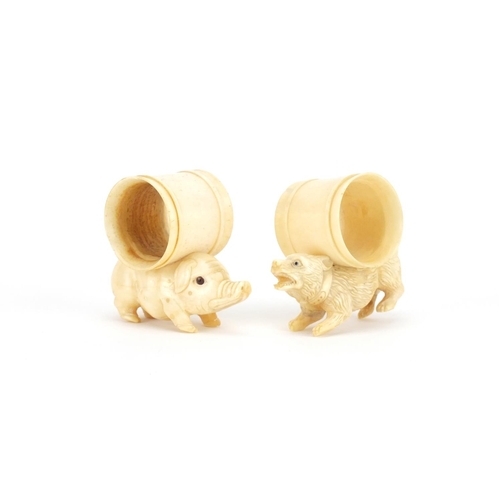 2342 - Two carved bone animal design napkin rings, the largest 8cm in length
