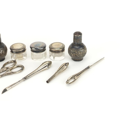 2269 - Silver objects including a pair of casters, sewing items and inkwells, the largest 11cm in length
