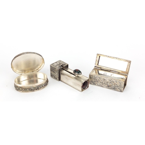 2262 - Rectangular silver compact and an oval Chinese silver pill box, the largest 6cm in length, 68.8g