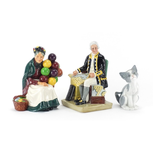 2077 - Lladro cat and two Royal Doulton figures, Captain Cook HN2889 and The Old Balloon Seller HN1315, the... 