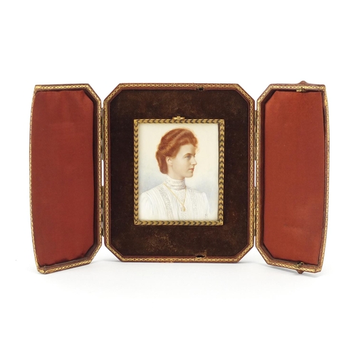 2311 - Rectangular hand painted portrait miniature of a red headed female, housed in a gilt metal framed wi... 