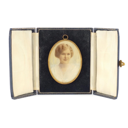2313 - Oval hand painted portrait miniature of a young female wearing a pearl necklace, housed in a gilt me... 