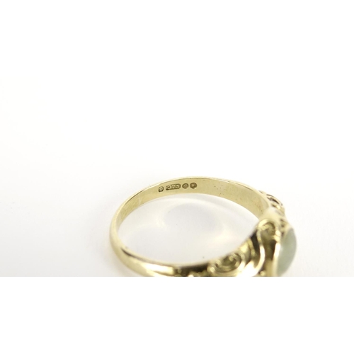 2372 - 9ct gold jade ring with scrolled shoulders, size O, 3.0g