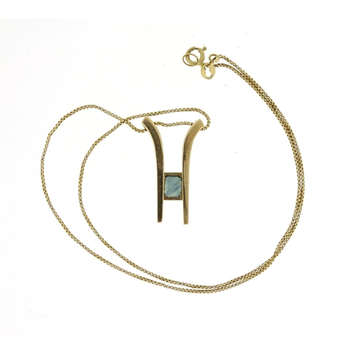 2369 - Unmarked gold green stone pendant (tests as 9ct gold and sapphire) on a 10ct gold necklace, 36cm lon... 