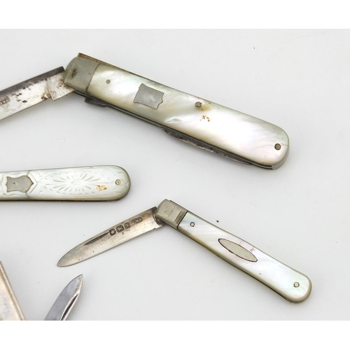 2265 - Three silver and mother of pearl folding fruit knives and a silver flanked multi tool, the largest 8... 