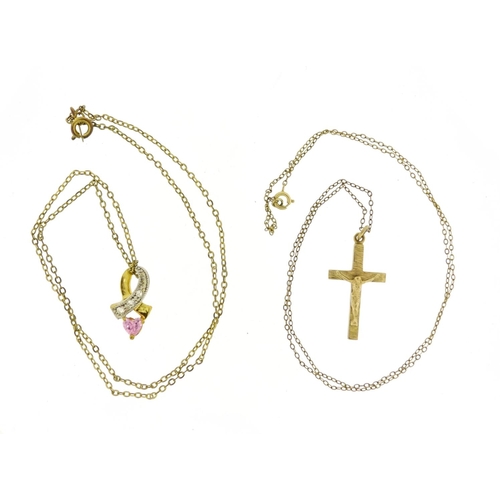 2437 - 9ct gold crucifix pendant and one other, both on gold coloured metal necklaces