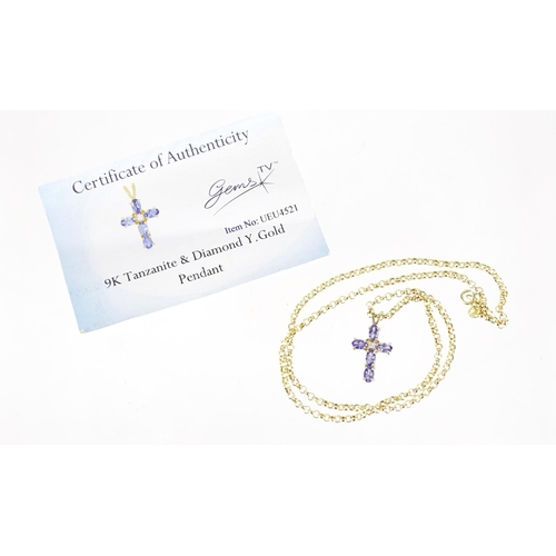 2449 - 9ct gold tanzanite and diamond cross pendant on a 9ct gold necklace, 3.6g