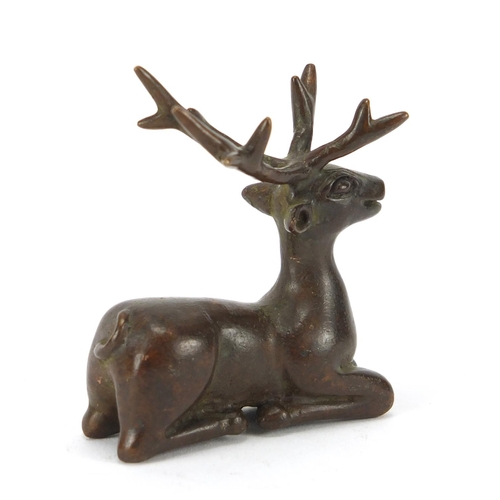 2287 - Japanese patinated bronze stag, impressed marks to the base, 6cm high