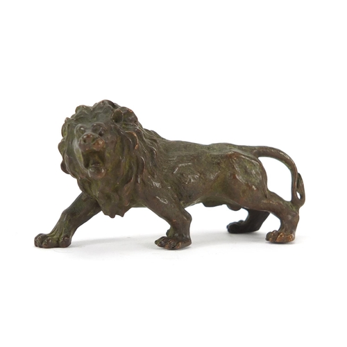 2284 - Japanese patinated bronze lion, impressed marks to the underside, 8cm in length