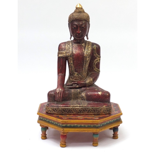 2166 - Large Burmese painted carved wood figure of Buddha, raised on an octagonal stand hand painted with f... 