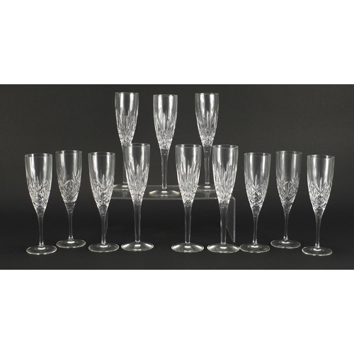 2132 - Two sets of six crystal champagne flutes comprising Stuart and Royal Doulton, 21.5cm and 23cm high