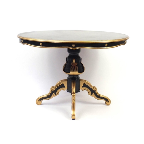 2007 - Italian style black and gold painted circular dining table and four chairs, with cream leather butto... 