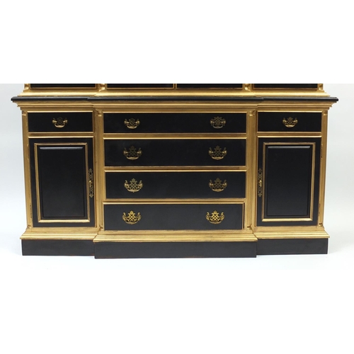 2002 - Italian style black and gold painted display cabinet with four glazed doors above a series of drawer... 
