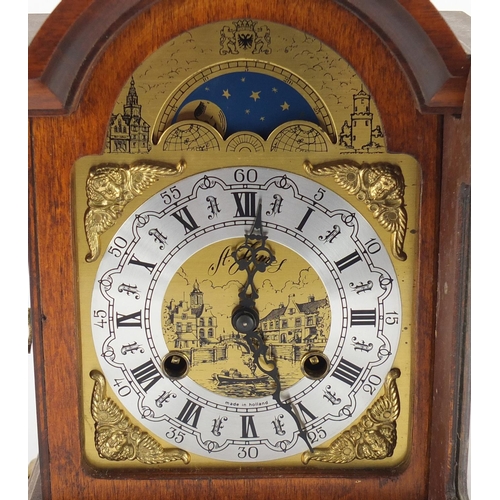 2067 - Franz Hermle mahogany cased mantel clock with moon phase dial, 28cm high