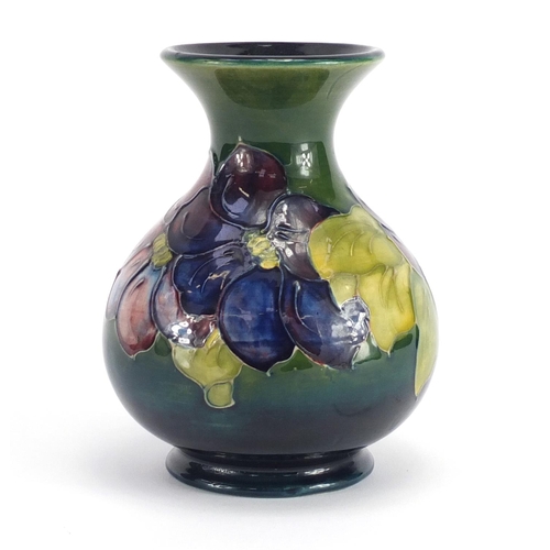 2079 - Moorcroft pottery baluster vase, hand painted with flower heads, 13cm high