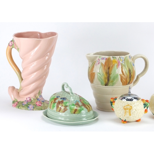 2160 - Clarice Cliff Newport pottery including a large cornucopia vase and jug, the largest  25cm high