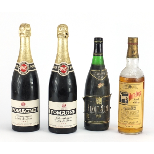 2198 - Four vintage bottles of alcohol comprising White Horse scotch whisky, two bottles of 1965 Pomagne an... 