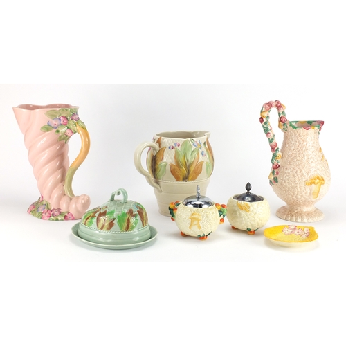 2160 - Clarice Cliff Newport pottery including a large cornucopia vase and jug, the largest  25cm high