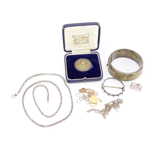 2441 - Mostly silver jewellery including a Victorian bangle, gilt locket on chain and coin mount brooch, 10... 