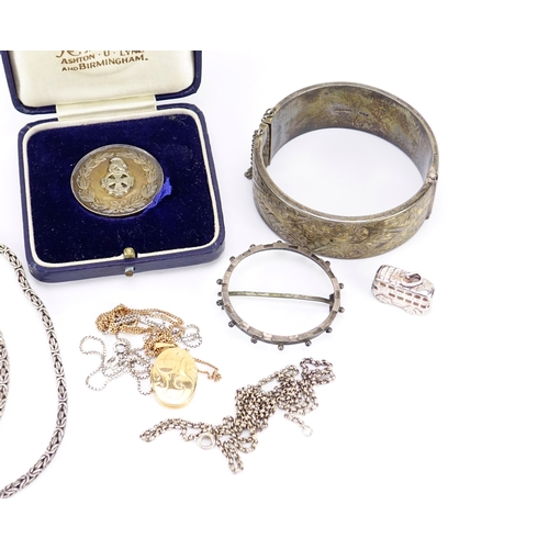 2441 - Mostly silver jewellery including a Victorian bangle, gilt locket on chain and coin mount brooch, 10... 