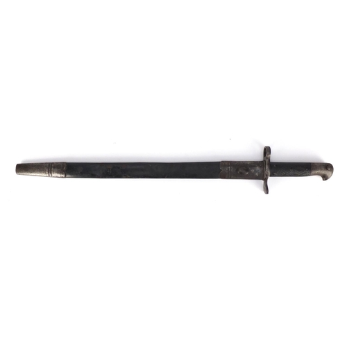 321 - German Military interest saw back bayonet with scabbard, impressed marks to the blade, 63.5cm wide