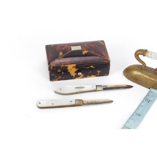 60 - Objects comprising a tortoiseshell casket, Victorian brass iron design tape measure with agate handl... 