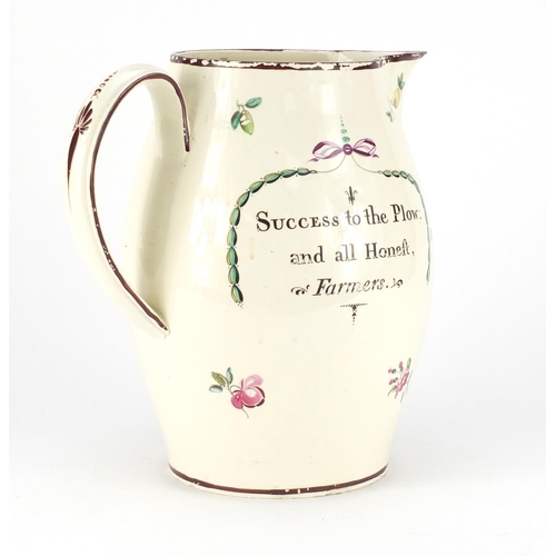 751 - Late 18th century creamware ale jug, hand painted with flowers, inscribed Success to the Plow and al... 