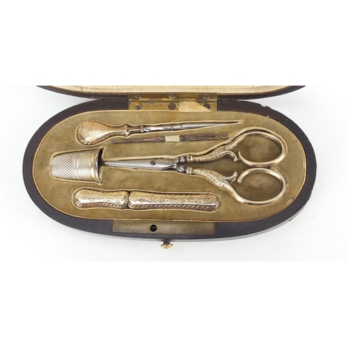 52 - 19th century French ebonised necessaire housing silver gilt implements including scissors, needle ca... 