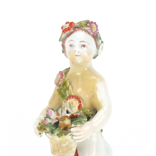 758 - 18th century Bow hand painted figure of putti holding flowers, 12.5cm high