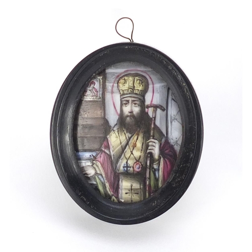 111 - Antique Russian enamel icon hand painted with a St Joseph, housed in an ebonised framed, script to t... 