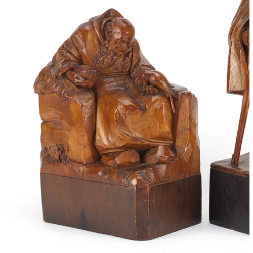 27 - Two 19th century continental wood carvings of monks, the largest 32.5cm high