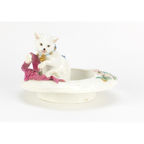 768 - Victorian pottery cat in a straw hat, hand painted with a blue bow and holding a pink ribbon, 22cm i... 