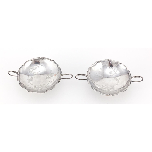 592A - Pair of Chinese silver sweetmeat dishes with twin handles by Wang Hing, each engraved with a bird am... 