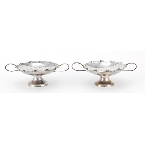 592A - Pair of Chinese silver sweetmeat dishes with twin handles by Wang Hing, each engraved with a bird am... 