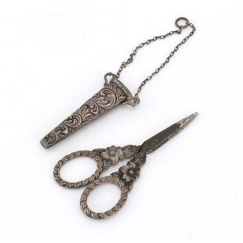 897 - Pair of Victorian unmarked silver chatelaine sewing scissors with case, 9cm in length, 12.0g