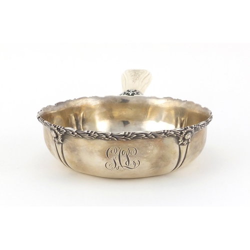 869 - 19th century sterling silver chrysanthemum porringer by Tiffany & Co, with carved ivory handle, 22cm... 