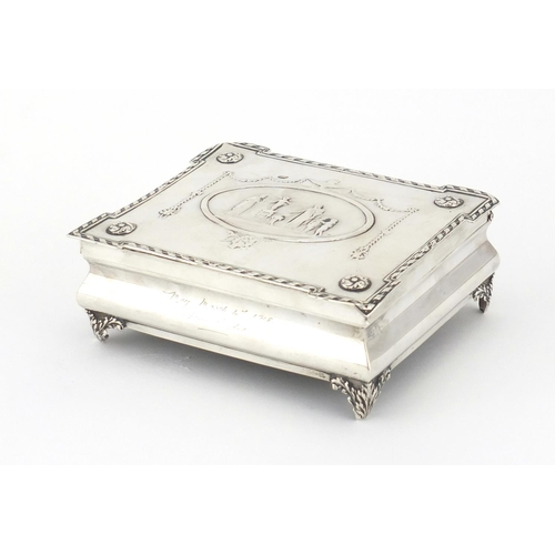 880 - Rectangular silver jewel box by William Comyns, the hinged lid embossed with maidens, putti, swags a... 