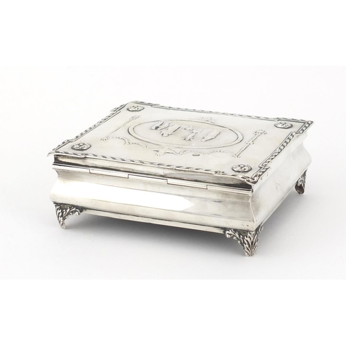880 - Rectangular silver jewel box by William Comyns, the hinged lid embossed with maidens, putti, swags a... 