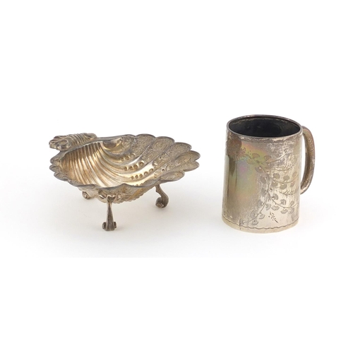 940 - Silver shell shaped open salt and an aesthetic style Christening tankard, various hallmarks, the sal... 