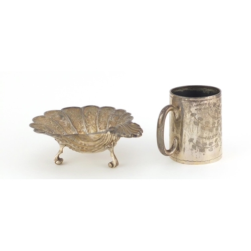 940 - Silver shell shaped open salt and an aesthetic style Christening tankard, various hallmarks, the sal... 