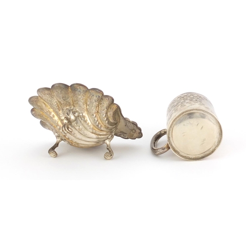 940 - Silver shell shaped open salt and an aesthetic style Christening tankard, various hallmarks, the sal... 